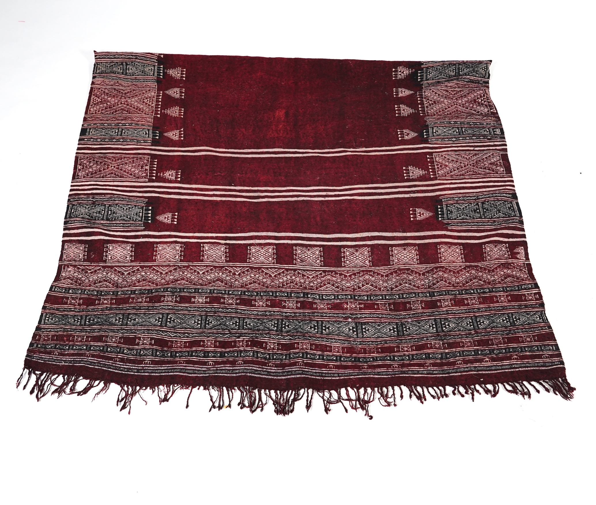 A Tunisian Amazigh, Berber maroon and white woven wool wall hanging, possibly 107 x 125cm